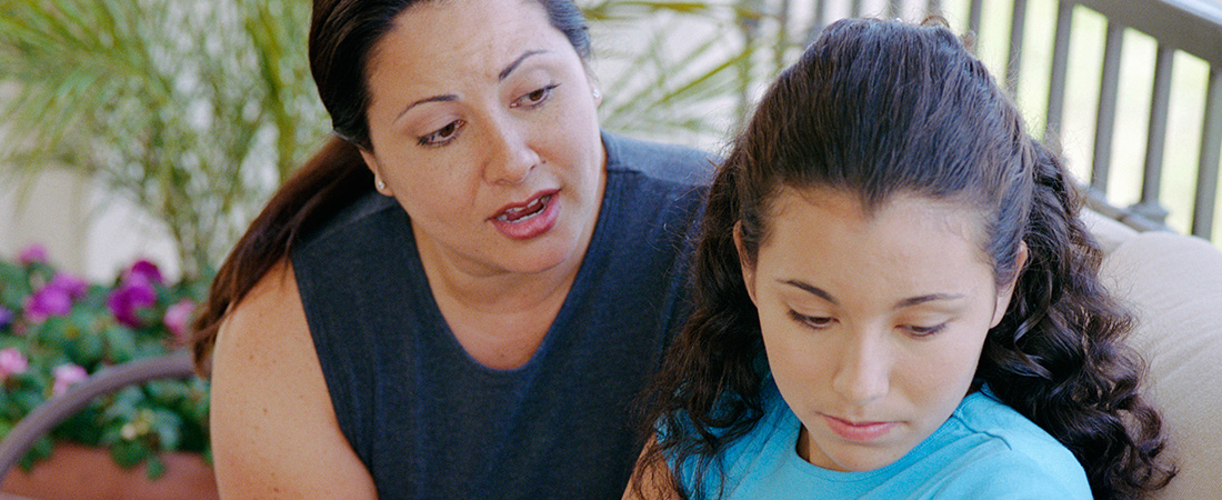 A mother talking with her daughter