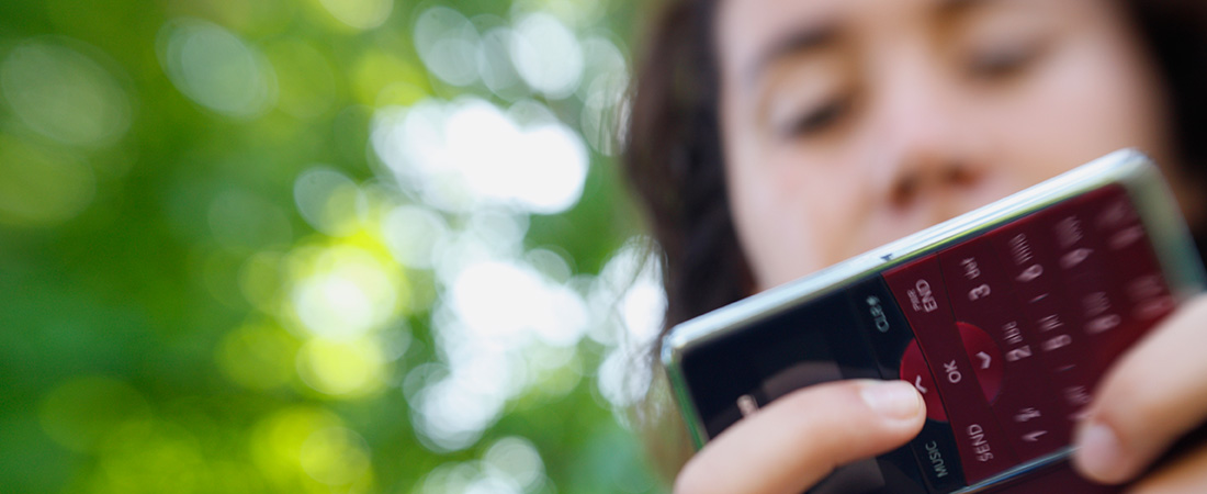 A picture of a teenager sending a text