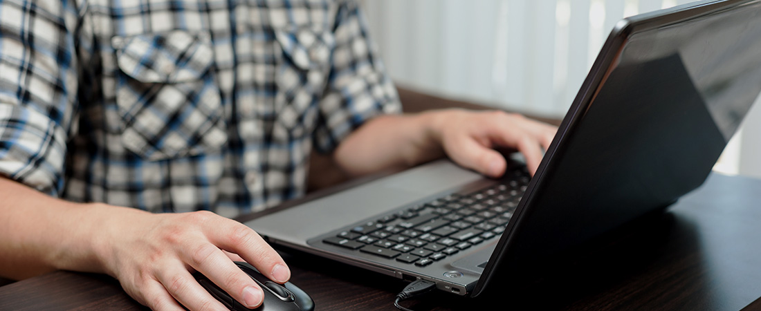 A picture of a person using a computer.