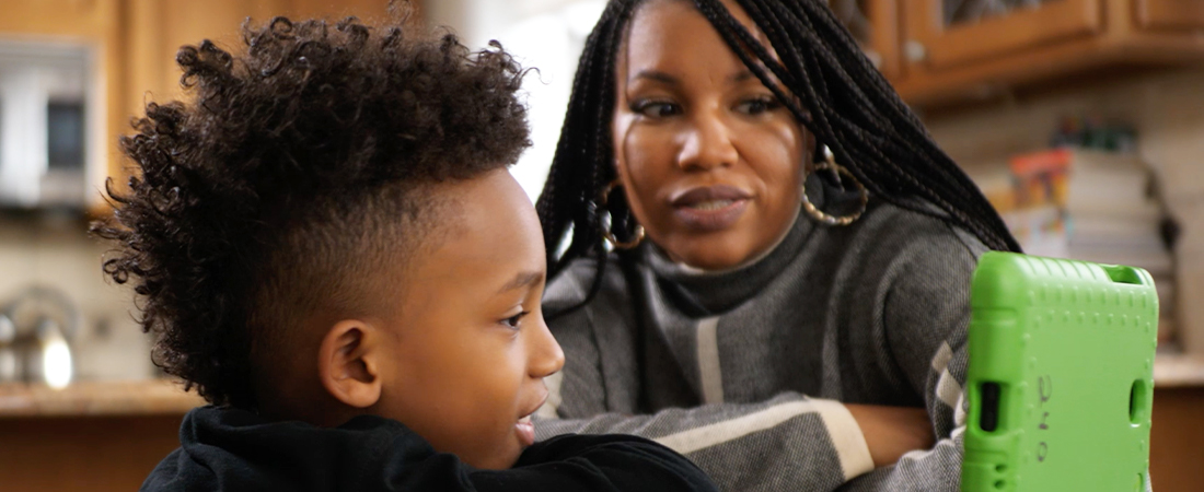 A photo of a parent and child representing Learning with Media, One Adventure at a Time