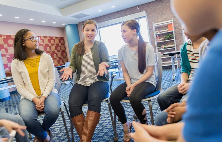 A photo of students having a discussion