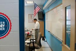 A picture of a classroom teacher with a badge