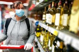 A photo of a person shopping for alcohol representing Balancing Competing Priorities: Preventing Substance Misuse during COVID-19