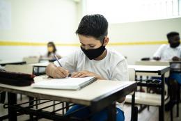 A student in a classroom representing Helping Students Make and Keep Friends in the COVID-19 Era