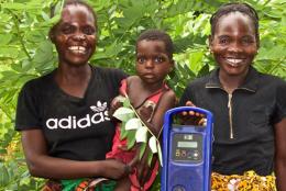 A photo of parents and child with a radio