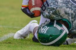 Student athletes playing football