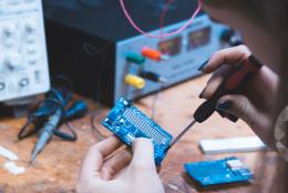 A photo of a person engaged in engineering activity representing How Should Schools Prepare Students for Jobs of the Future? 