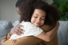 A photo of parent and child representing Tips for Parents: Integrating SEL into Remote Learning